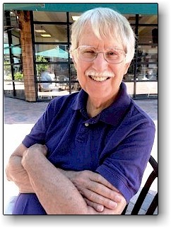 Ken with arms crossed